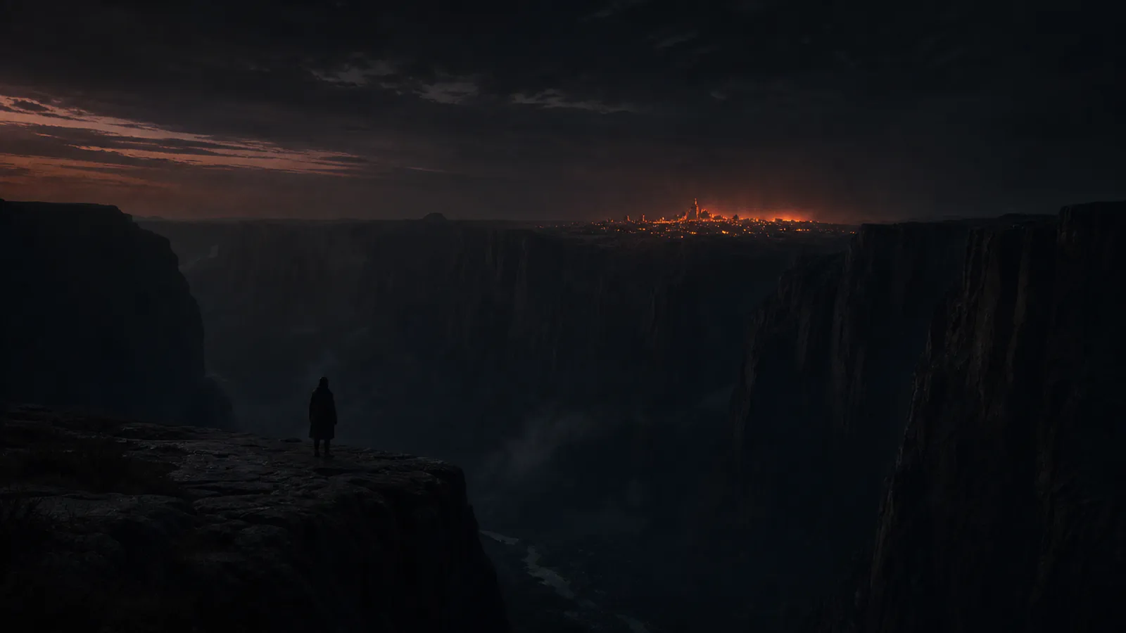 A lone figure at the edge of a dark canyon, an ember-lit city glowing on the far ridge.